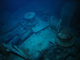 Forecastle capstans and anchor cable secured on deck